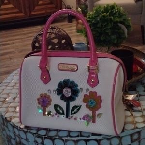 Nicole Lee Pink and flower 🌹 scene on front of purse. With straps never used.